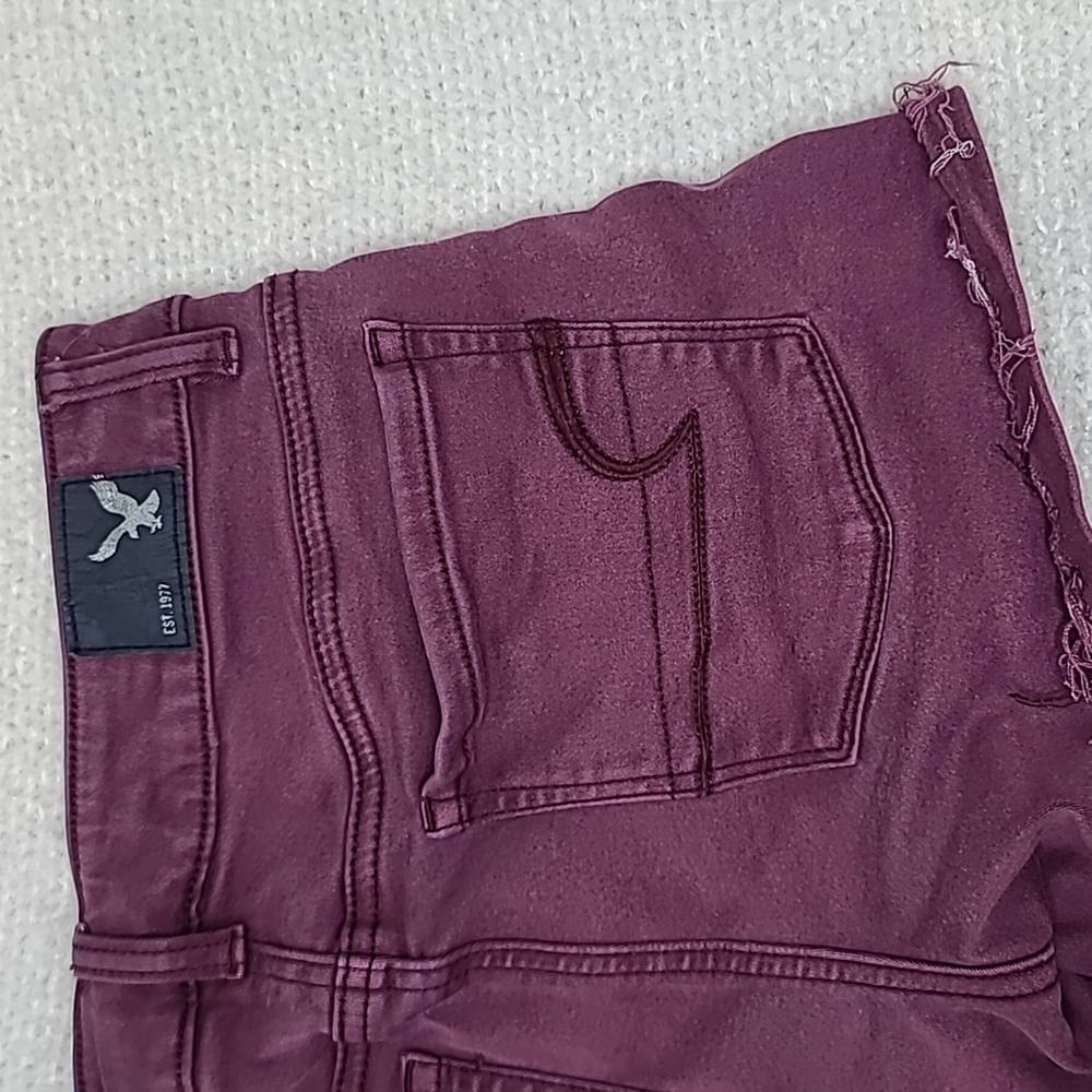 AE Next Level Low Rise Cuffed Raw Hem Cotton Denim Shortie Shorts in Burgundy - Picture 15 of 17
